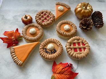 Decorated Thanksgiving sugar cookies to look like little pies. 