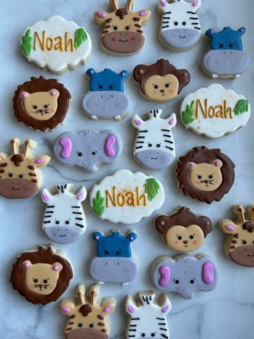 Safari animal themed sugar cookies including a hippo, giraffe, lion, monkey and elephant. 