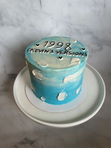 Blue sky and cloud theme birthday cake. 