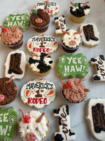 Rodeo themed birthday cookies and cupcakes with highland cows and paisley. 
