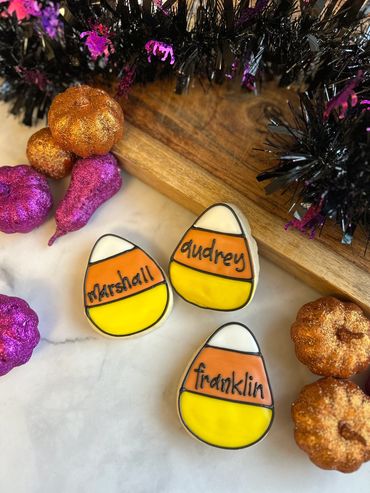 Individual name candy corn decorated sugar cookies. 