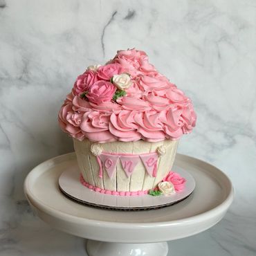 Floral theme giant cupcake in buttercream for first birthday