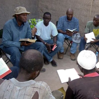 Group of men having a Bible study session.