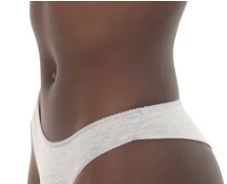 Side view of a person wearing white underwear.