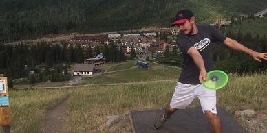 Distance champion Henry Childres crushes a disc on hole 18 at Solitude, Salt Lake City, Utah. 