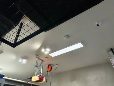 Lighting upgrade complete: flat panel garage lights installed by Ellia Electric Inc.