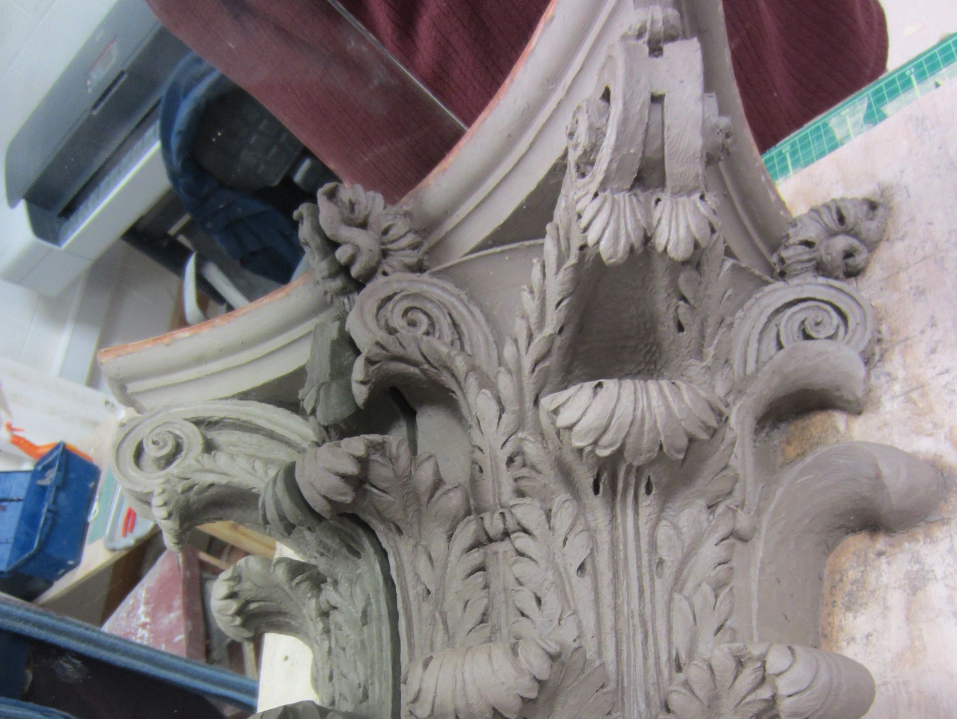 Intricately carved architectural capital with floral designs.