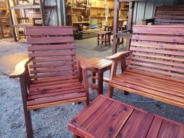 Cedar outdoor furniture.  The chairs, tables and bench look beautiful and stand up to the weather 