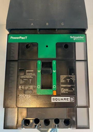 Schneider Electric PowerPact circuit breaker with switch and labels.