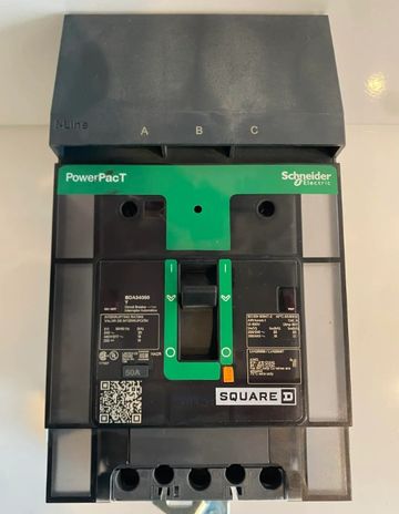 Schneider Electric PowerPacT circuit breaker with green switch and black casing.