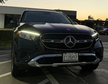 Front view of a black Mercedes-Benz SUV at dusk.