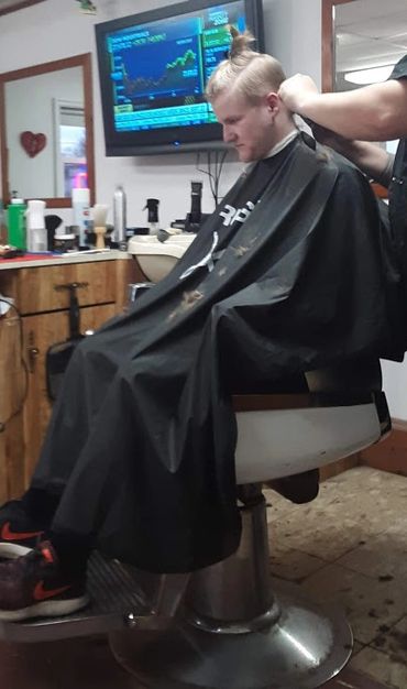 Teenage boy receiving haircut, Phoenixville PA
