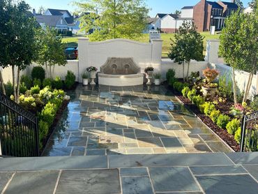 "This small decorative wall, featuring an integrated fountain, is a perfect blend of functionality a
