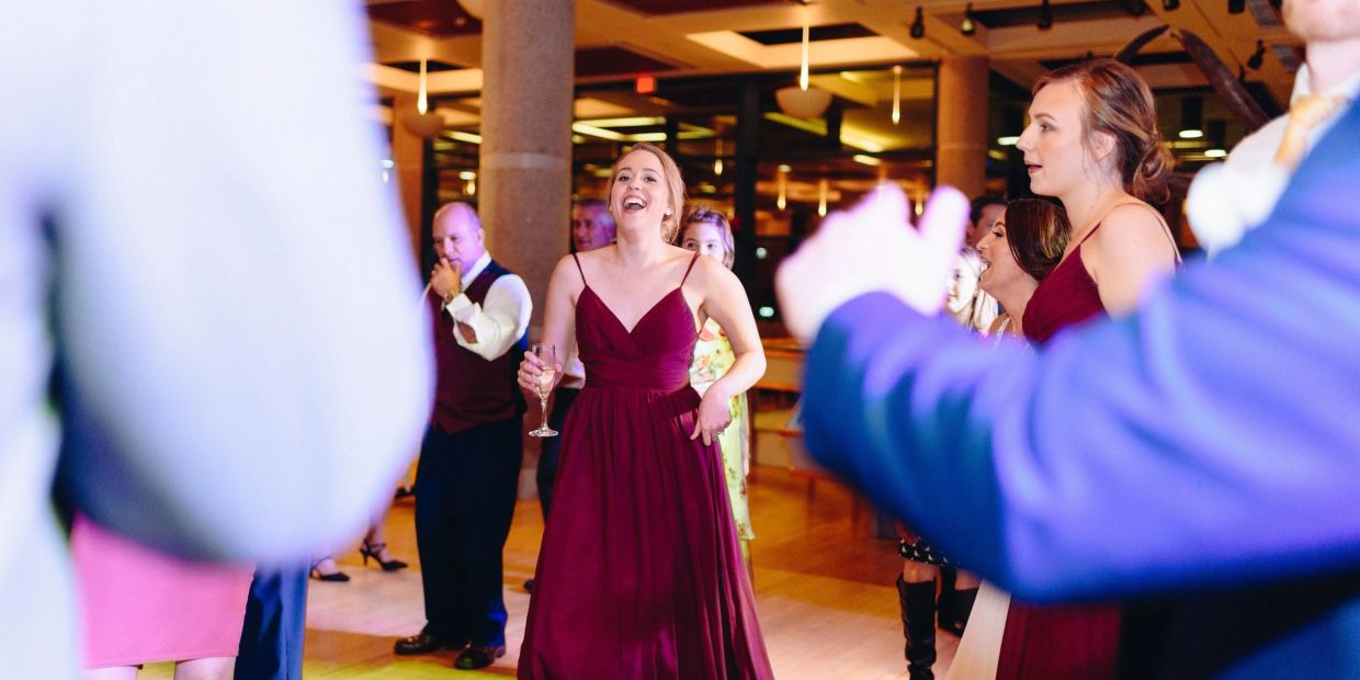 Bridesmaid enjoying a wedding dj in Omaha area venue