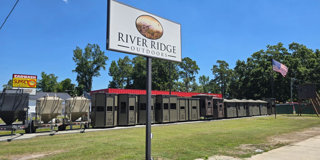 Outdoor gear store with hunting blinds and feeders.