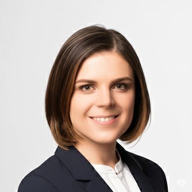 Professional woman with short brown hair smiling confidently.