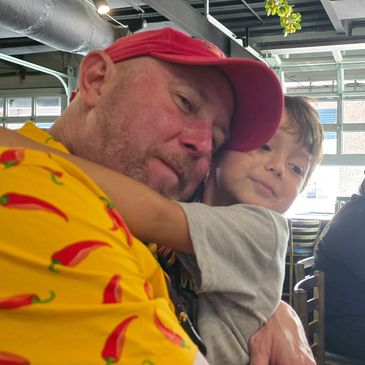 Man and boy hugging