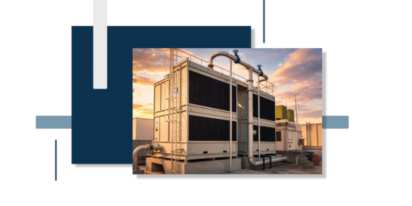 Large industrial cooling system on a rooftop at sunset.