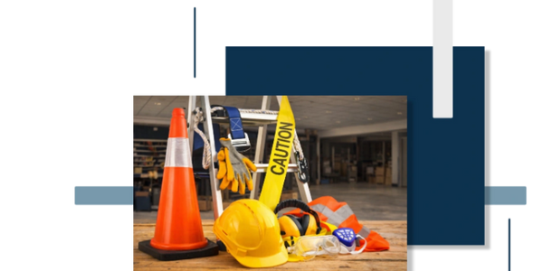 Construction safety gear including helmet, gloves, and caution cone.