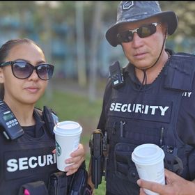 Security personnel from Kai'i International LLC standing guard.

