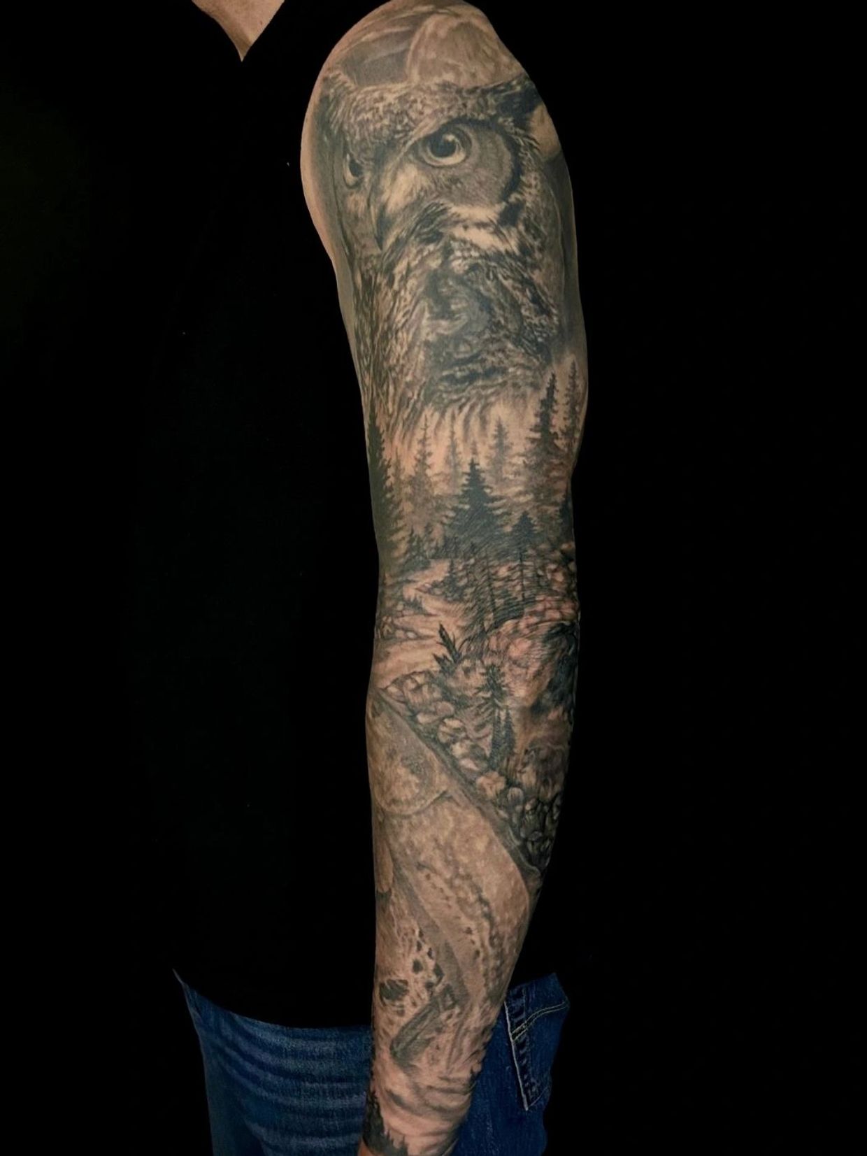 Black and grey owl realism tattoo sleeve designed and tattooed by Katie 