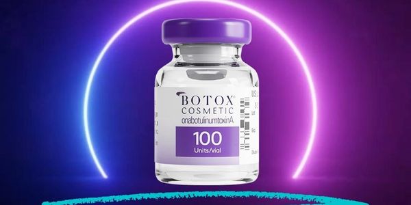 Vial of Botox 100 units with a purple blue hallow around it.