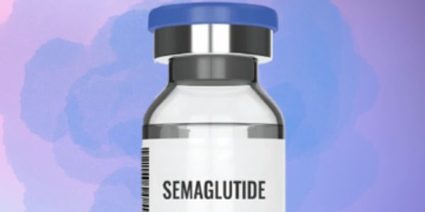 Medication vial of Semaglutide with a blue cap and blue background.