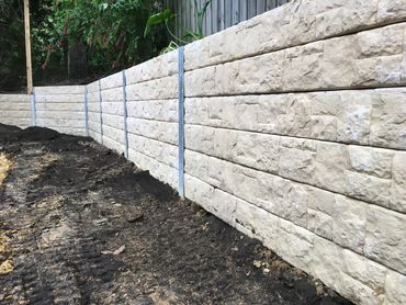 Concrete sleeper retaining wall - Cream coloured stone look sleeper