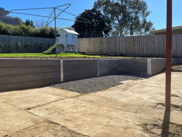 Charcoal concrete sleeper retaining wall

