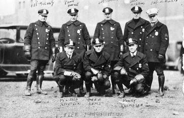 Vintage police officers group photo in uniform.