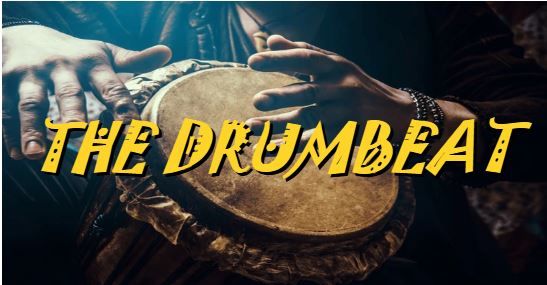 Hands playing a drum with 'THE DRUMBEAT' text overlay.