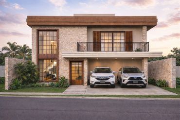 Modern two-story house with stone facade and two parked cars in the driveway.