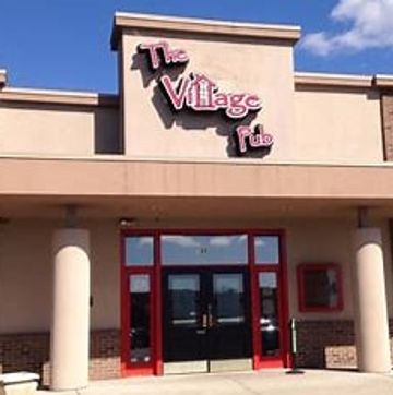 Exterior view of The Village Pub entrance.