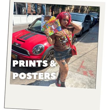 Woman with red hair holding colorful prints and posters.