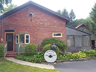 Landmark brick one-room school house converted to a home