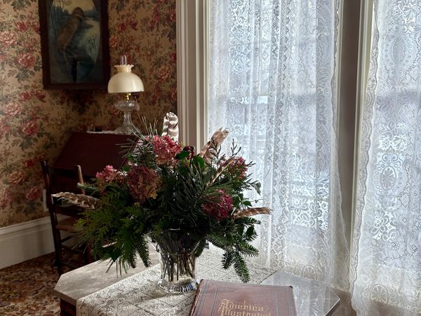 Rich-Twinn Octaagon House morning room with marble-top table and Cottage Lace curtains