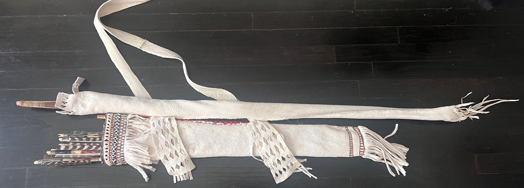 Apache style quiver of brain tanned deer, trade cloth and pigments. Sinew backed gambel oak bow and 