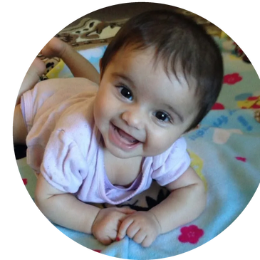 The toddler is happy and enjoying his day in daycare.