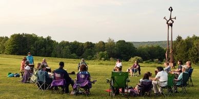 Drum circle underneath sculptures at Griffis Sculpture Park 