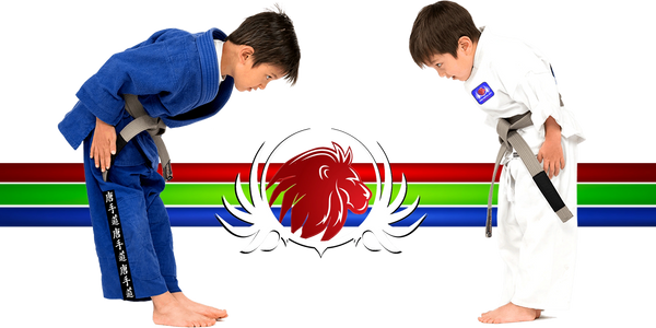 Two young martial artists bowing in gi uniforms at Pride Martial Arts, Oak Park, CA. 
