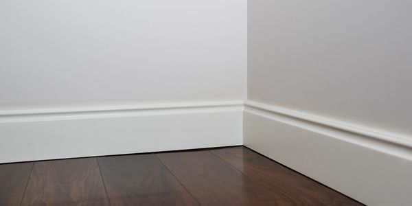 Floor trim for a portable restroom trailer.