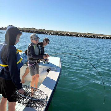 Boat adventure with kids fishing near Wrightsville Beach North Carolina.