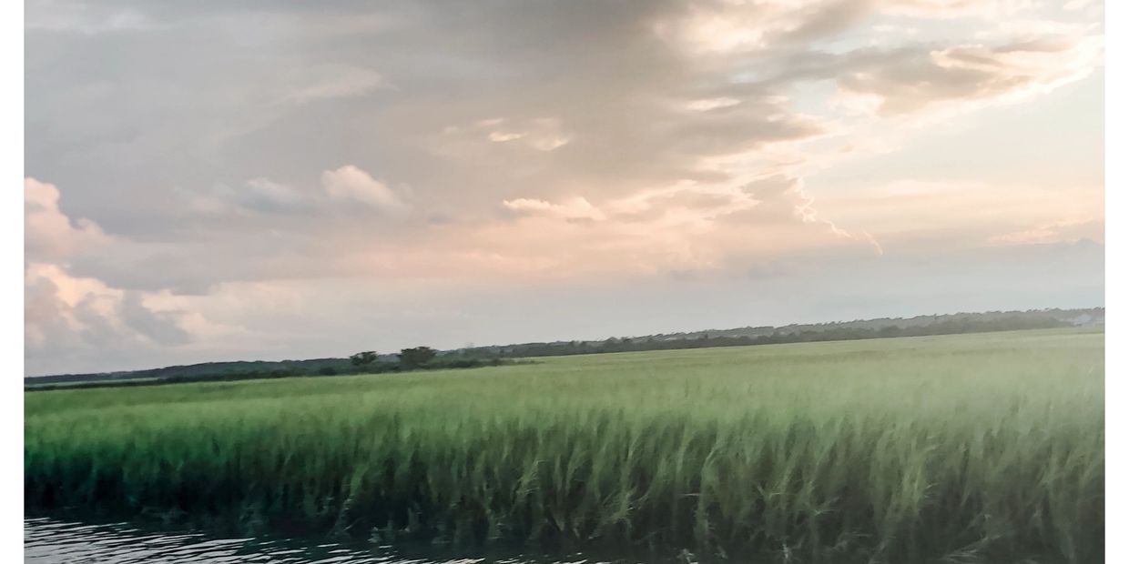 Sunset over marsh grass near Wrightsville Beach, NC.