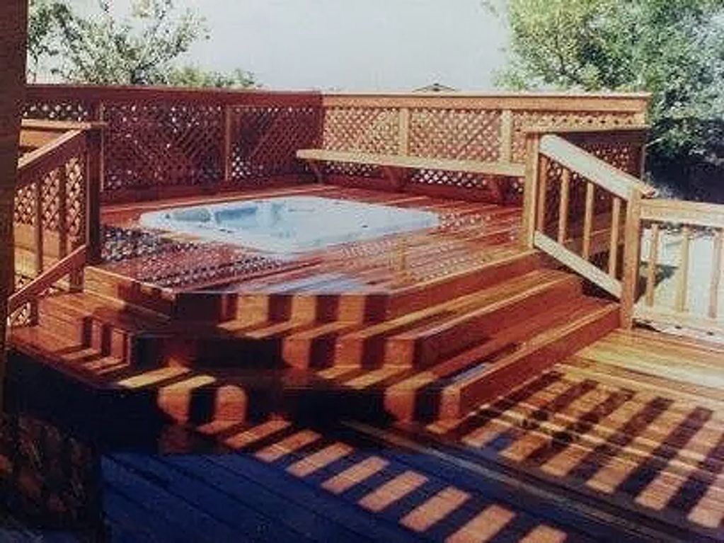 A custom redwood deck built by Orecal Construction LLC