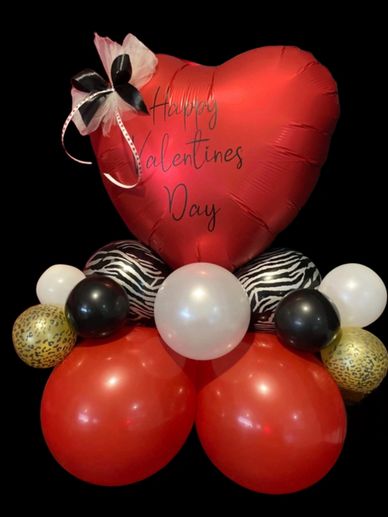 Balloon stack in red white gold and black with red love hear that reads happy valentines day