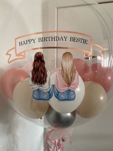 Clear balloon filled with smaller balloons with happy birthday bestie written on it with photo