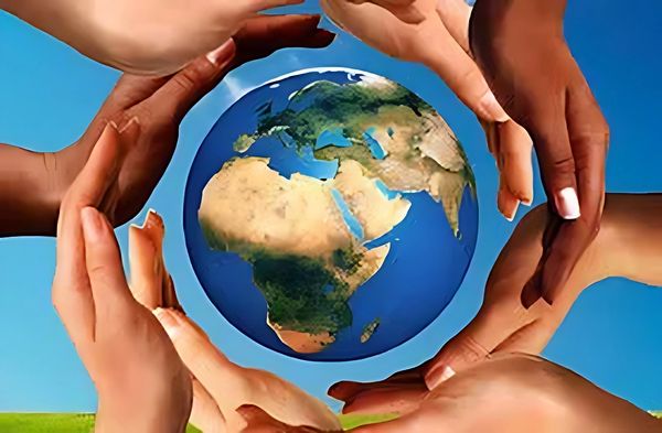 Image of a globe with all hands together