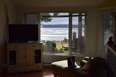Livingroom with view of beach in background 