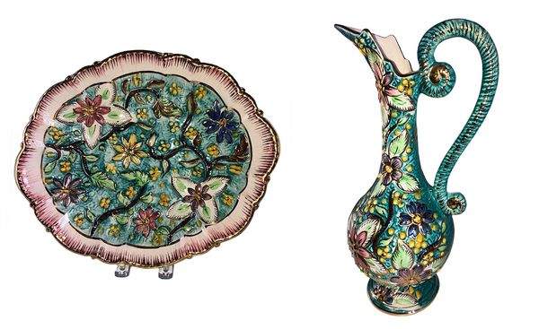 Decorative floral ceramic plate and pitcher with intricate designs.