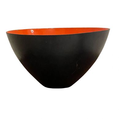 A wonderful Danish mid century bowl with red enamel interior and dark gray exterior. Circa 1950s.